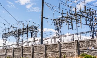 High voltage electricity towers and power lines at a transmission substation in South San Francisco Bay Area; San Jose, California